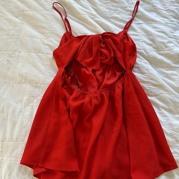 Red strap top with bow in back & open - Picture 2 of 3
